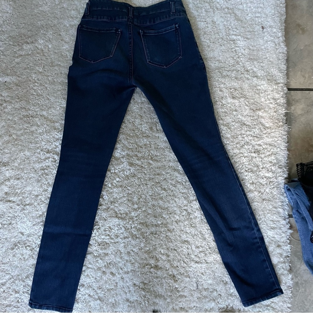 Refuge mid rise dark wash jeans.